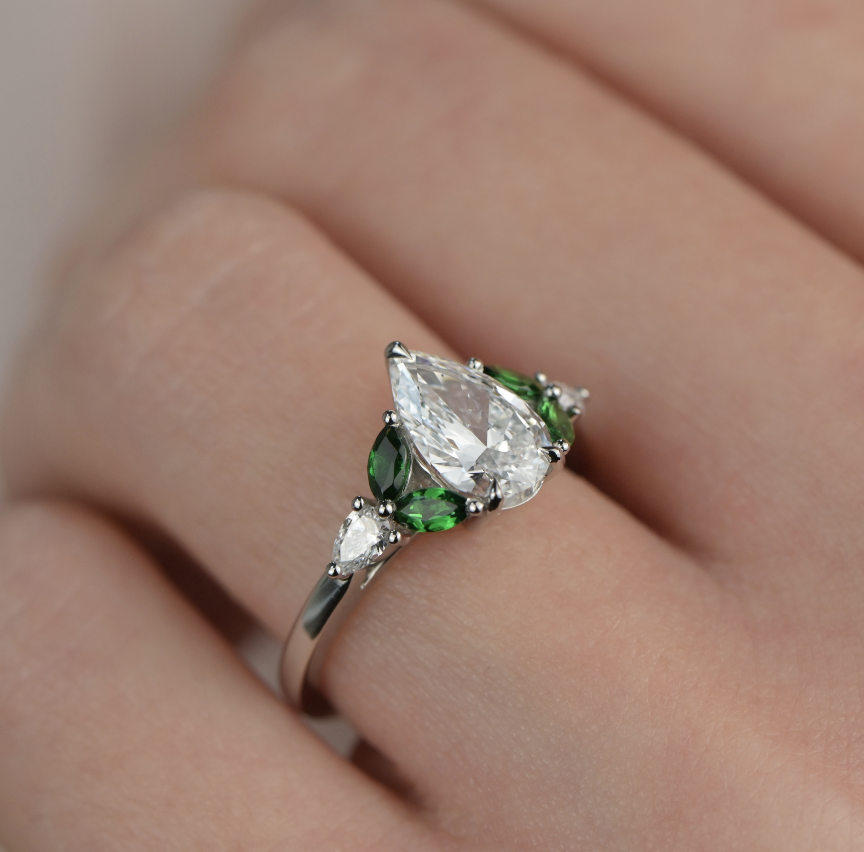 Tsavorite and diamond engagement ring