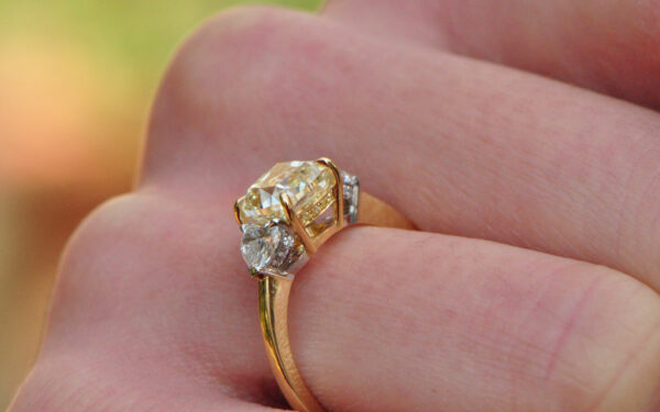 Yellow diamond and heart shaped trilogy ring