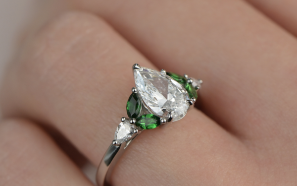 Tsavorite and diamond engagement ring