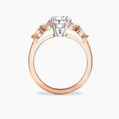 1 70ct pear cut diamond with champagne diamond side stones set in rose gold Primrose Through Finger