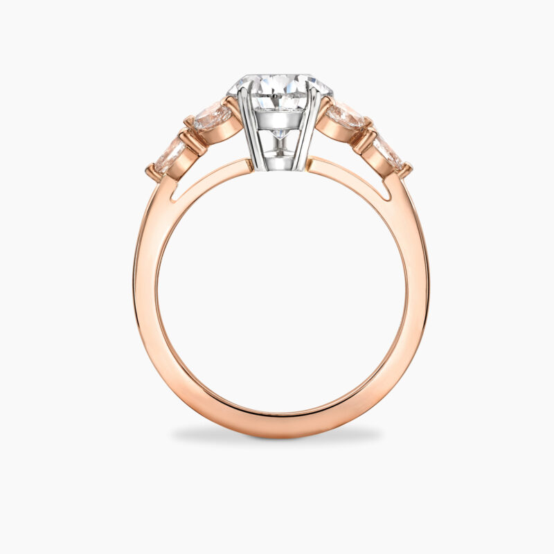 1 70ct pear cut diamond with champagne diamond side stones set in rose gold Primrose Through Finger