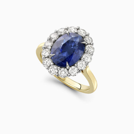 Royal blue sapphire and diamond cluster engagement ring created in yellow gold Wimbledon Perpective
