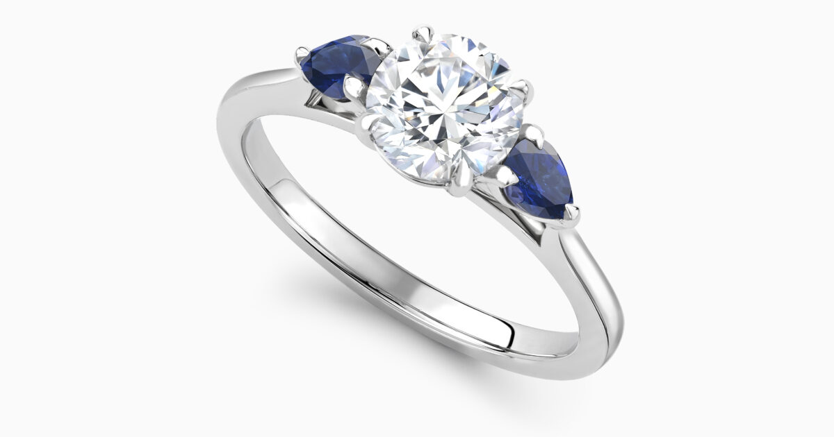 Diamond ring with clearance sapphire side stones