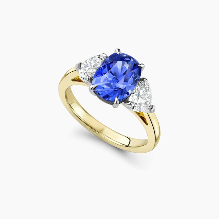 Cushion cut diamond outlet with sapphire side stones
