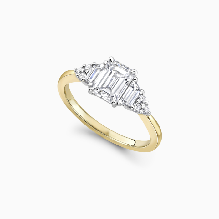 Emerald cut diamond new arrivals with trillion side stones